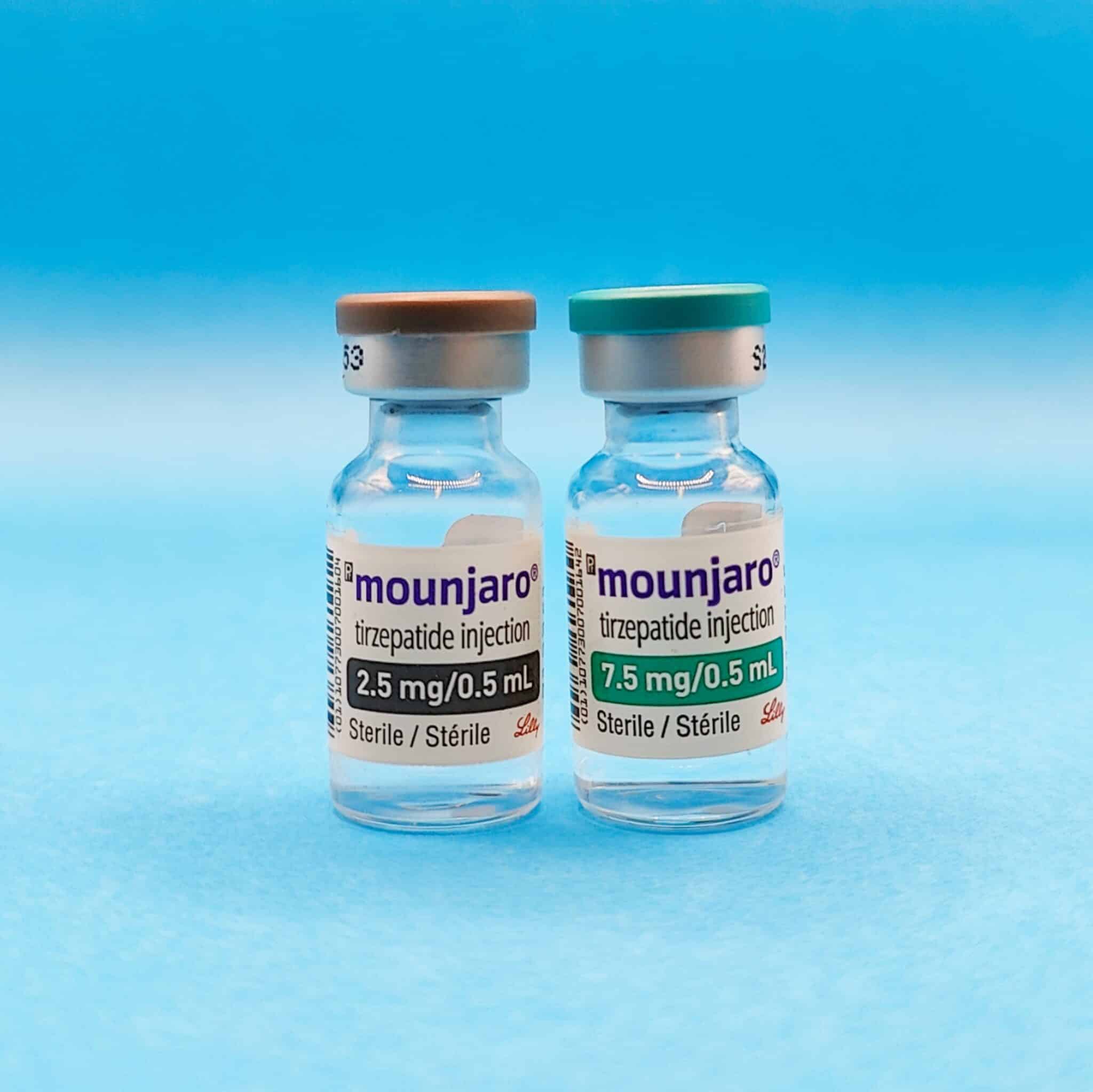 Two vials of Mounjaro (tirzepatide) placed on a clean surface, representing the medication in vial form