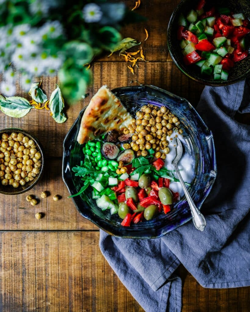 Plate of heart-healthy foods, including salmon, leafy greens, and whole grains, complementing Eliquis therapy