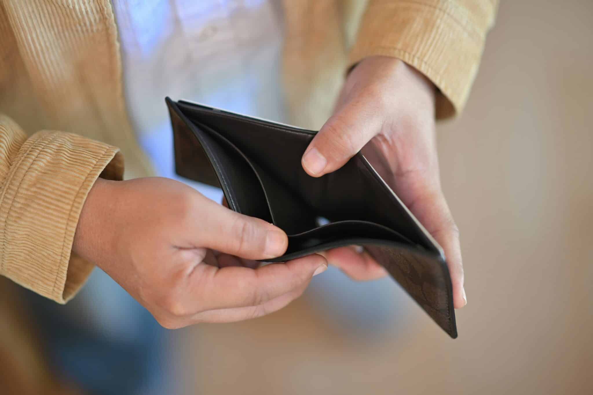 Person holding empty wallet