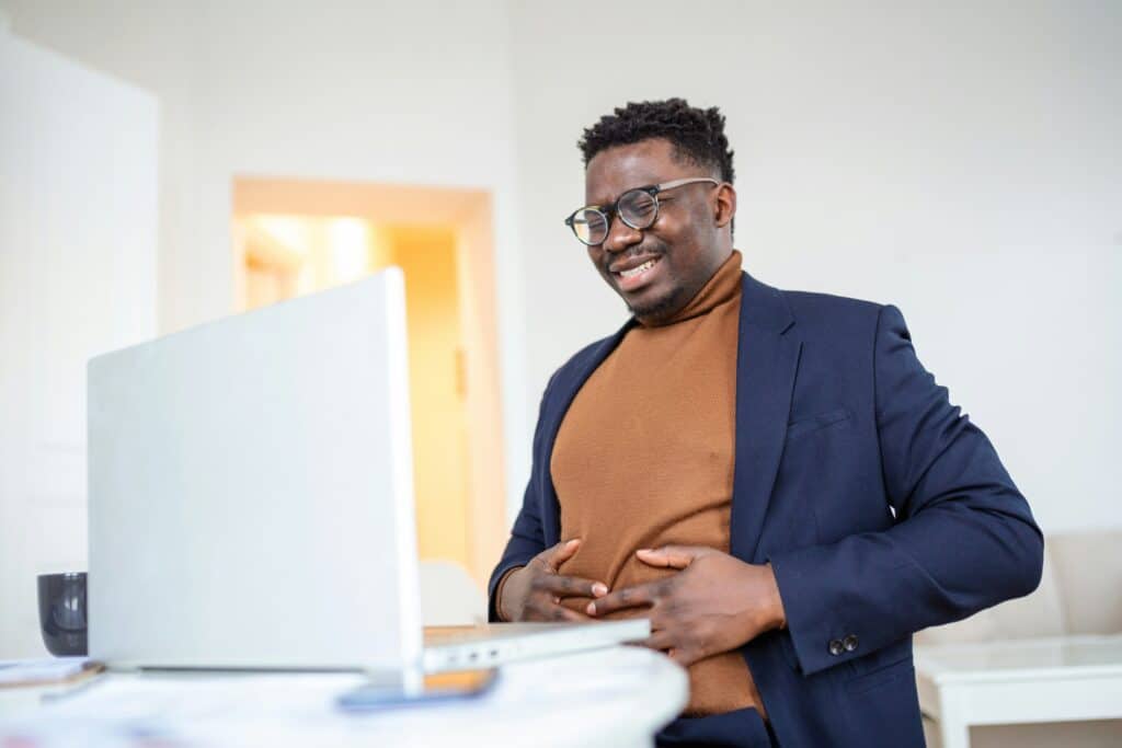 Man holding his abdomen in discomfort
