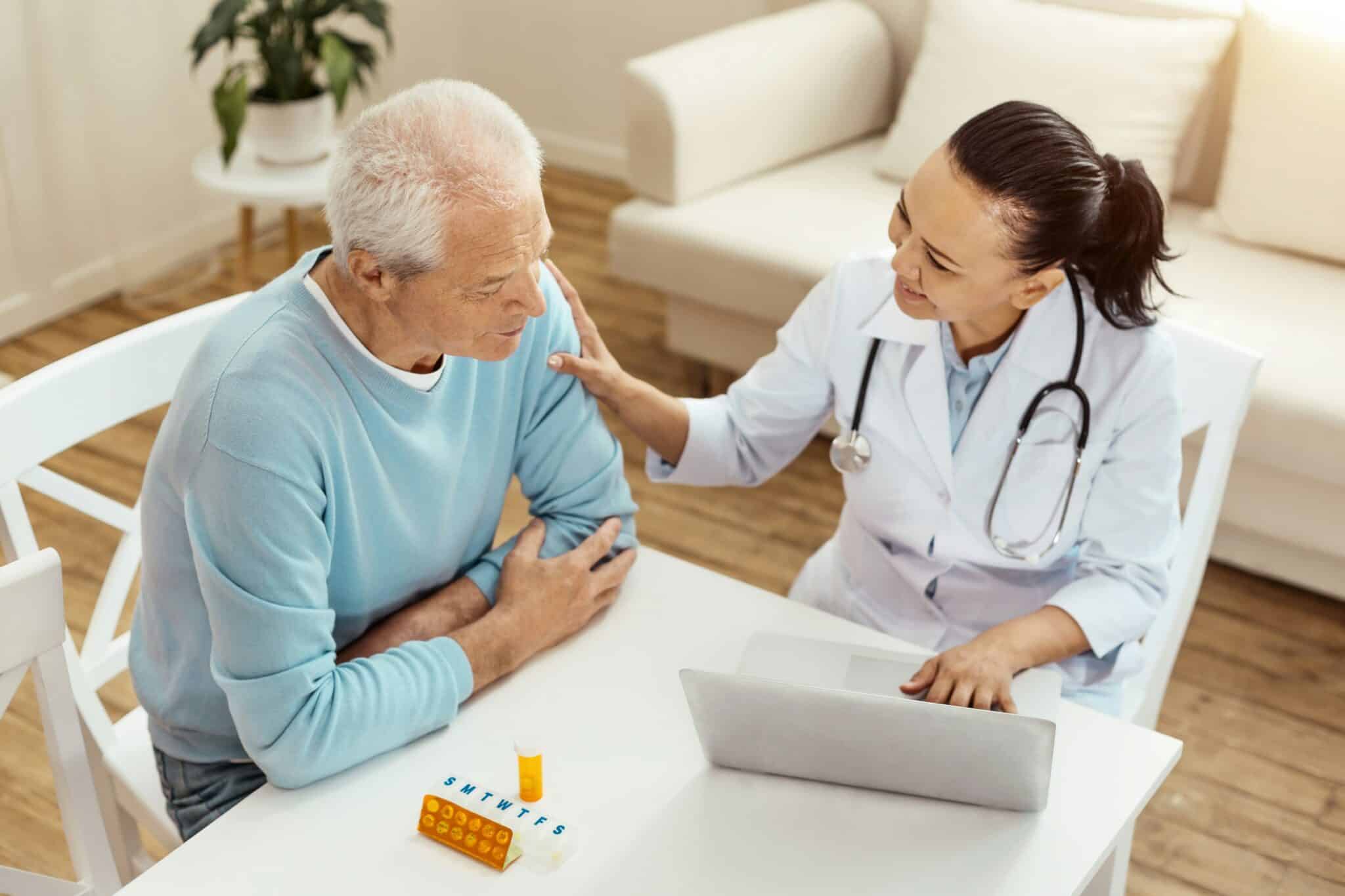 Doctor checking in on a patient during a home visit