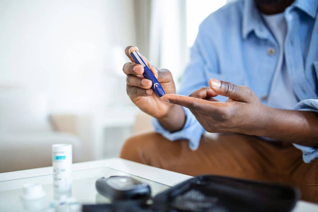 Man checking his blood glucose level