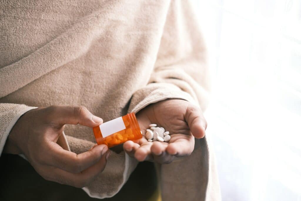 Woman with pills in her hand