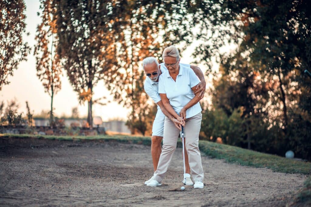 Elderly Couple playing Golf