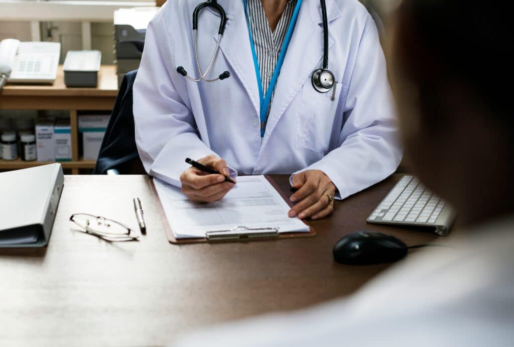 patient talking to doctor about switching to apixaban