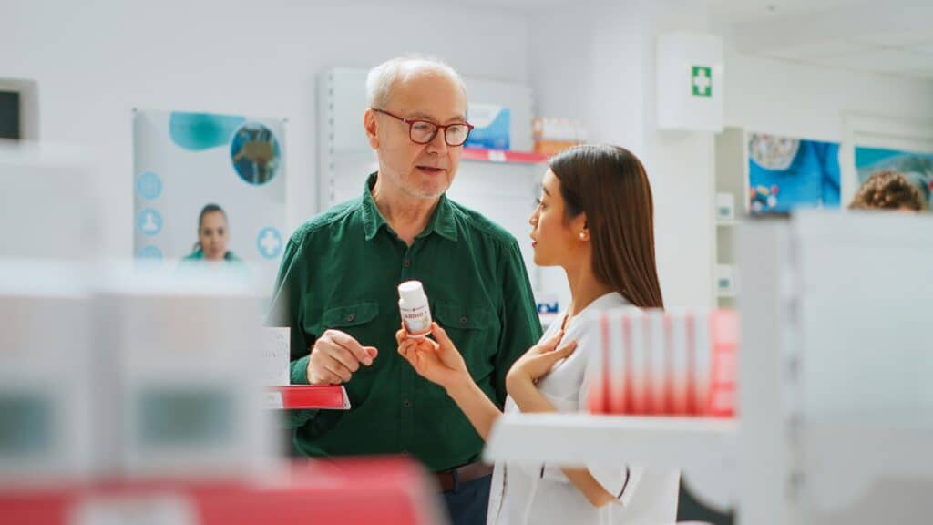 canadian pharmacist assisting patient