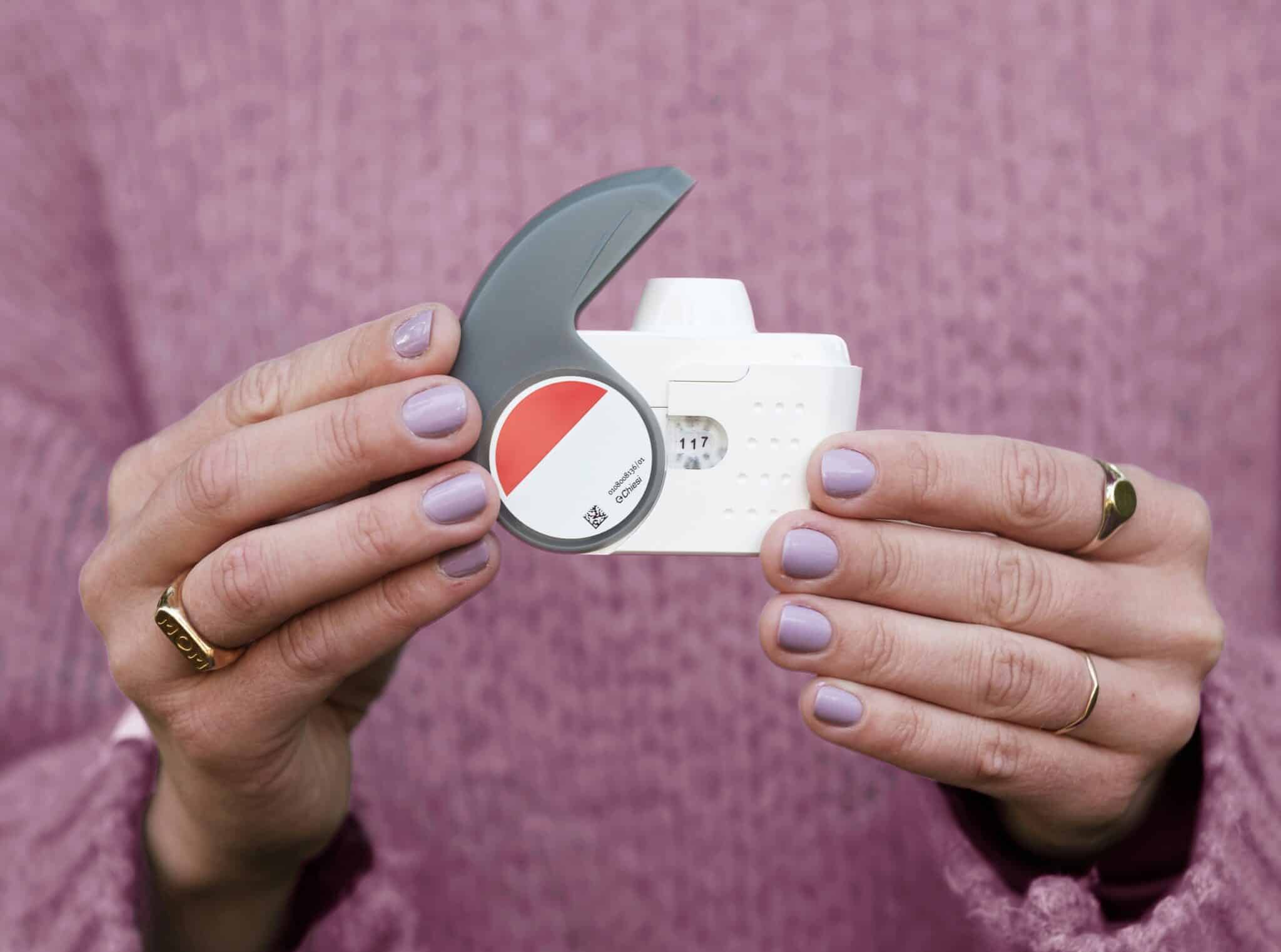 Woman holding inhaler