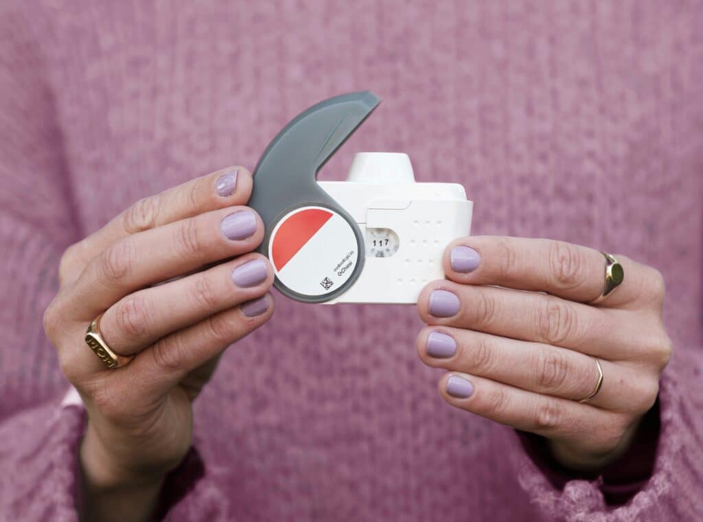 Woman holding an inhaler